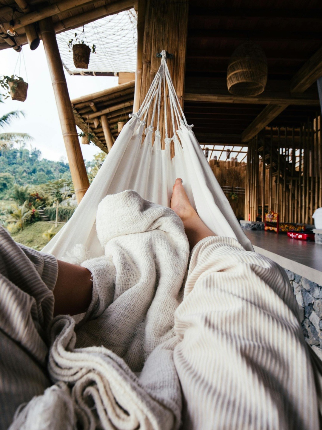 Person laying in a hammock Person laying in a hammock